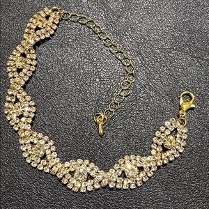 68.  Gold Tone Prong Set Rhinestone Bracelet